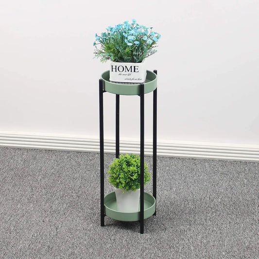 Green metal floor-standing plant stand with a black Stand