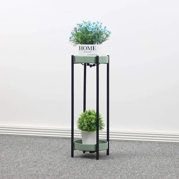 Green metal floor-standing plant stand with a black Stand