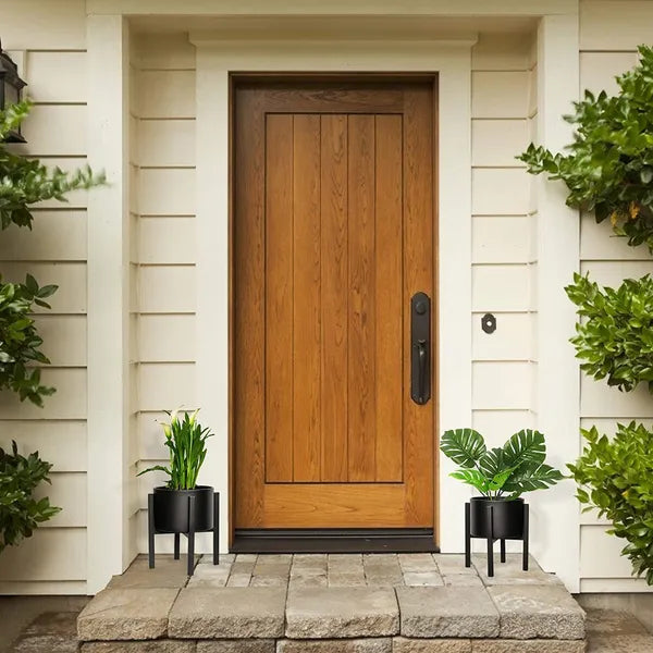 Black metal floor-standing plant stand with a black pot