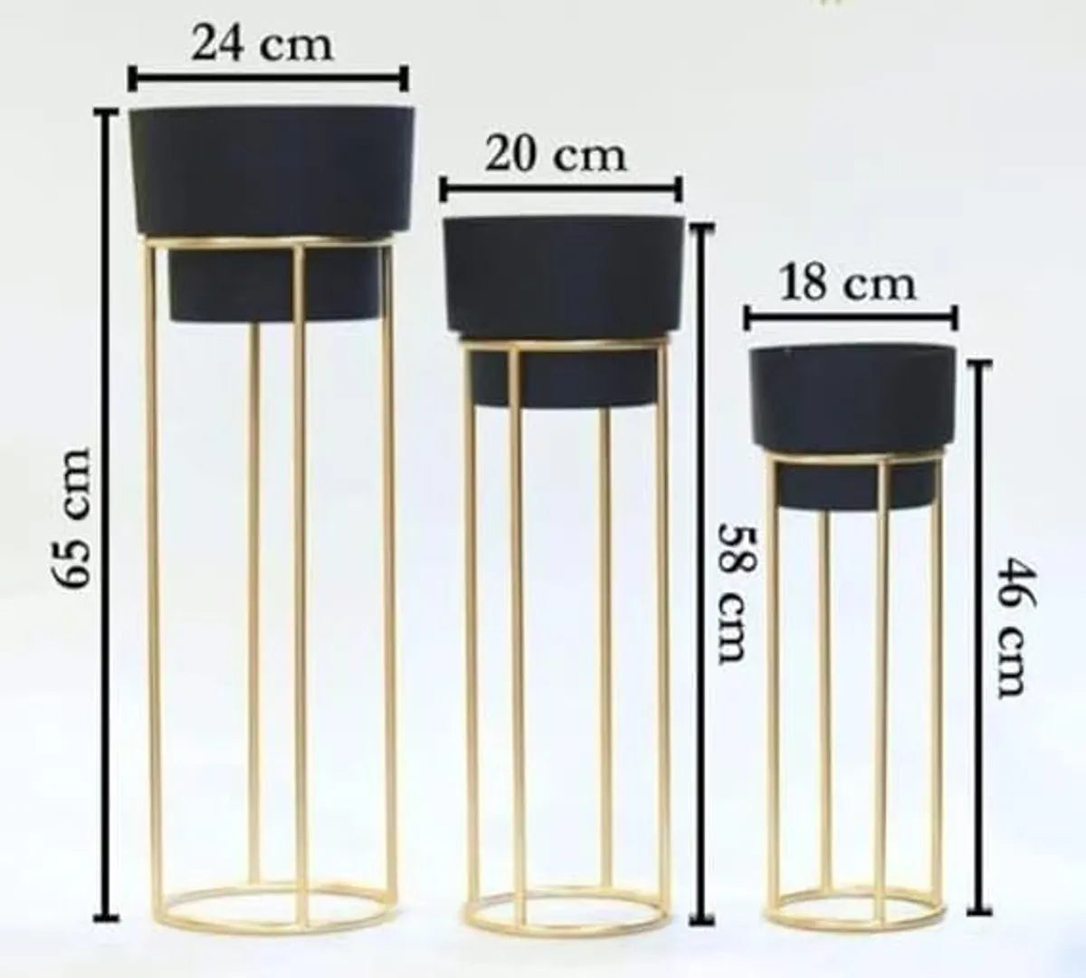 Golden metal floor-standing plant stand with a black pot